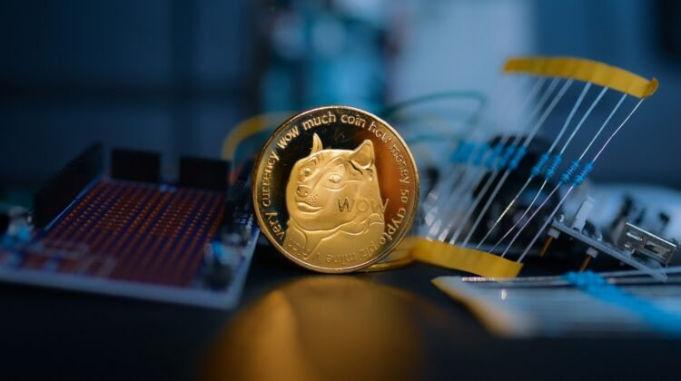 Dogecoin in front of electronics