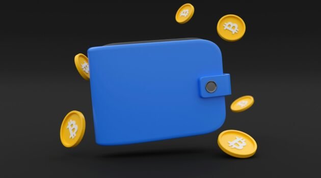 A wallet with bitcoins around it