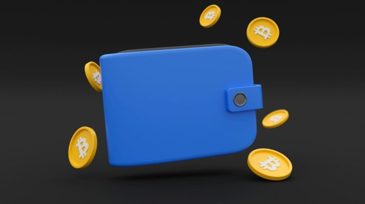 A wallet with bitcoins around it