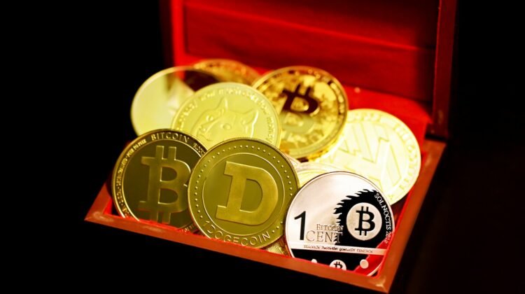 Various crypto coins in a small box